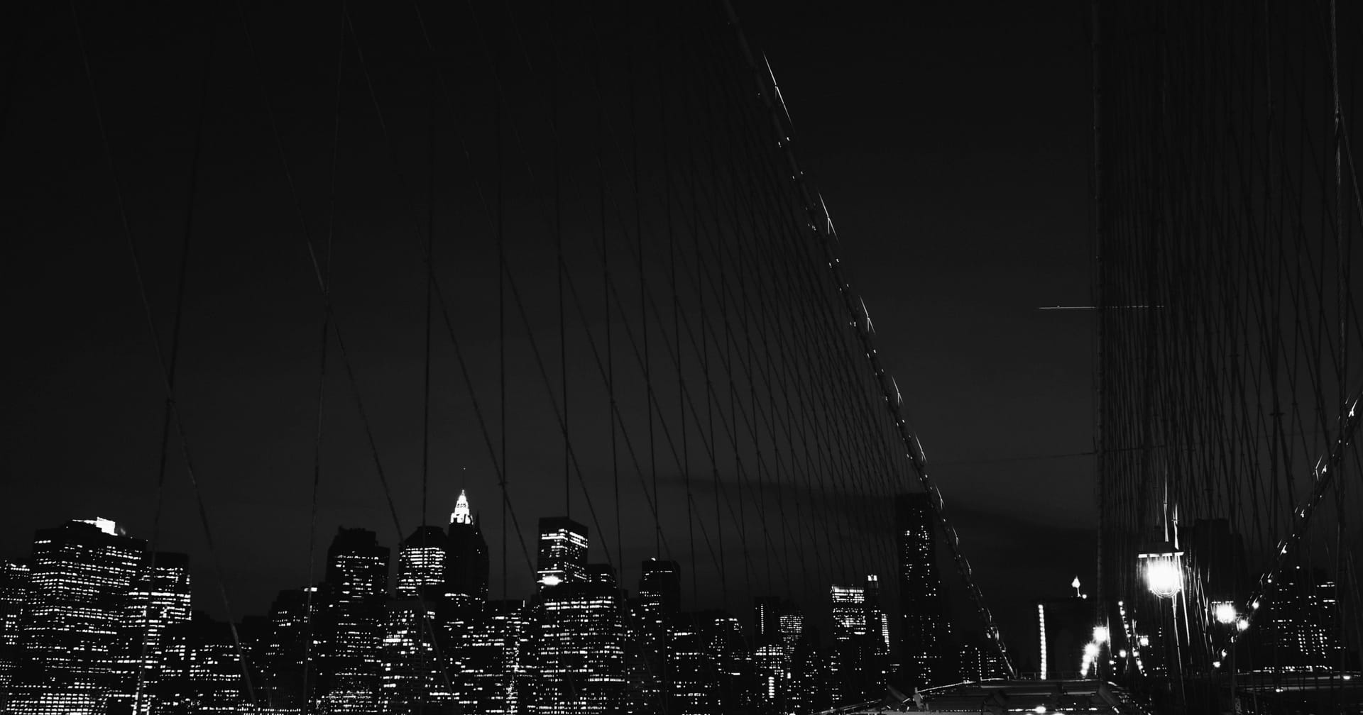 City skyline lit up at night, viewed from above